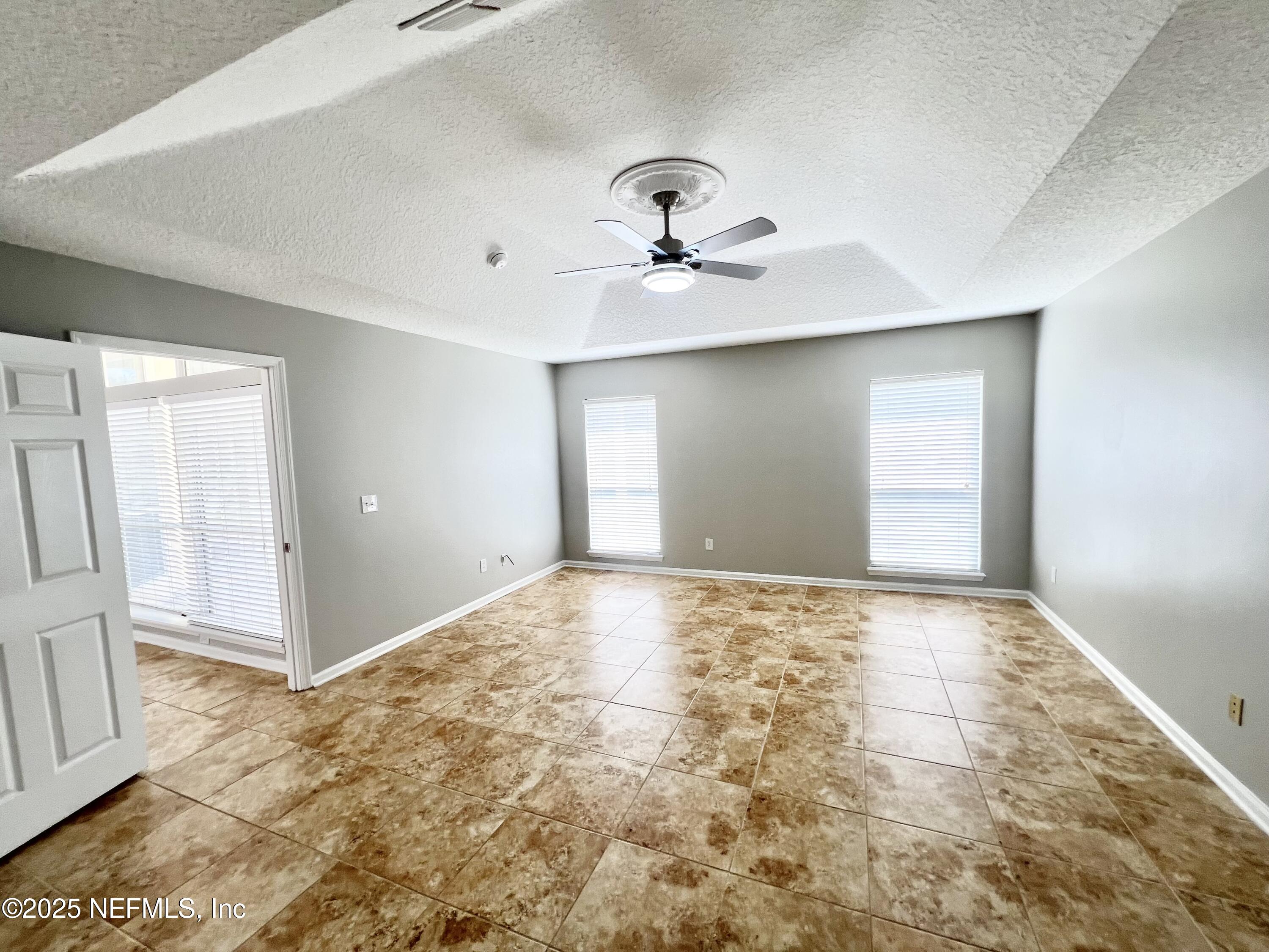 389 Sparrow Branch Circle St. Johns, FL 32259 - Photo 17 of 46 a view of an empty room with a window