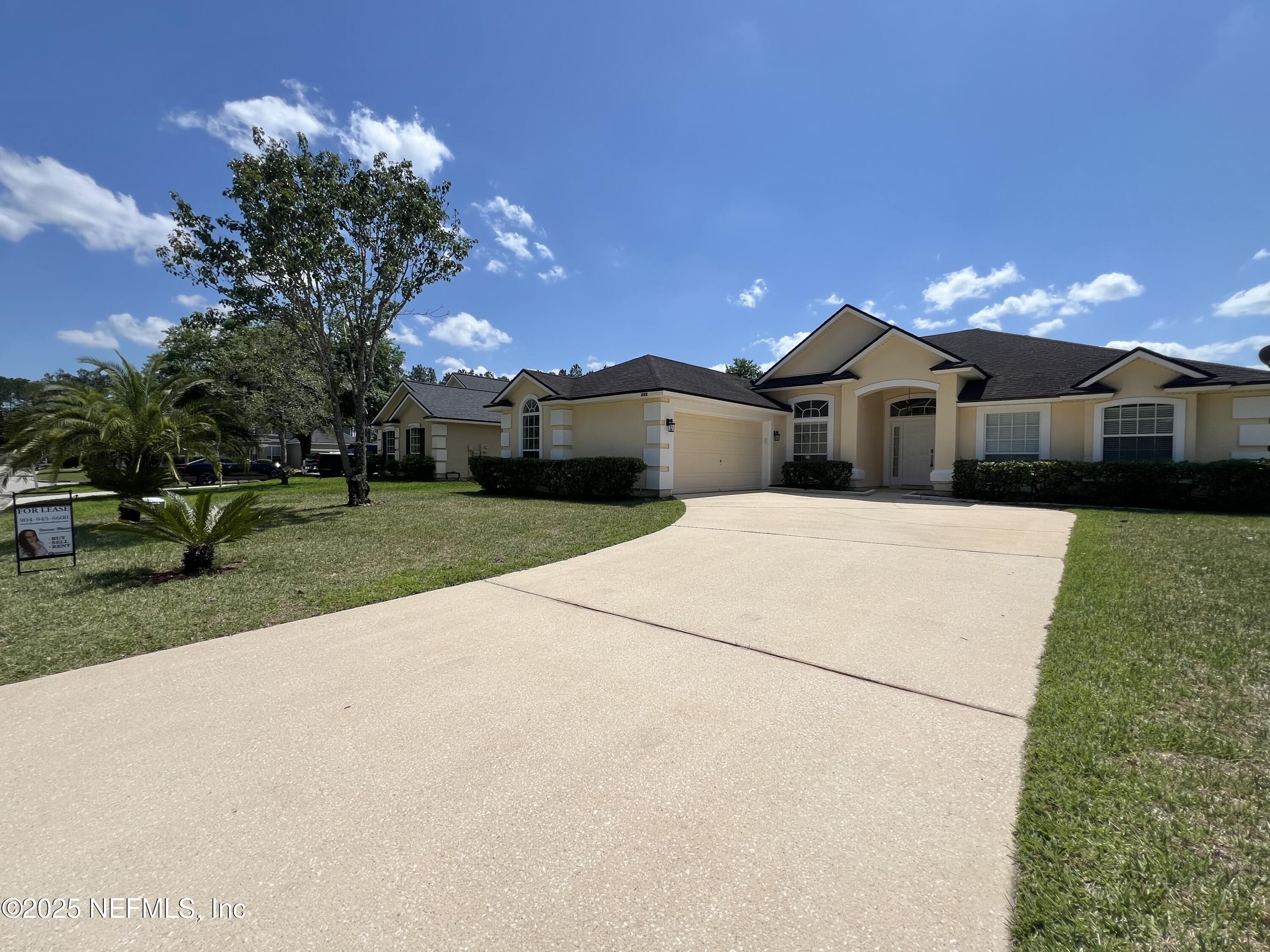 389 Sparrow Branch Circle St. Johns, FL 32259 - Photo 2 of 46 a view of a house with a yard and potted plants
