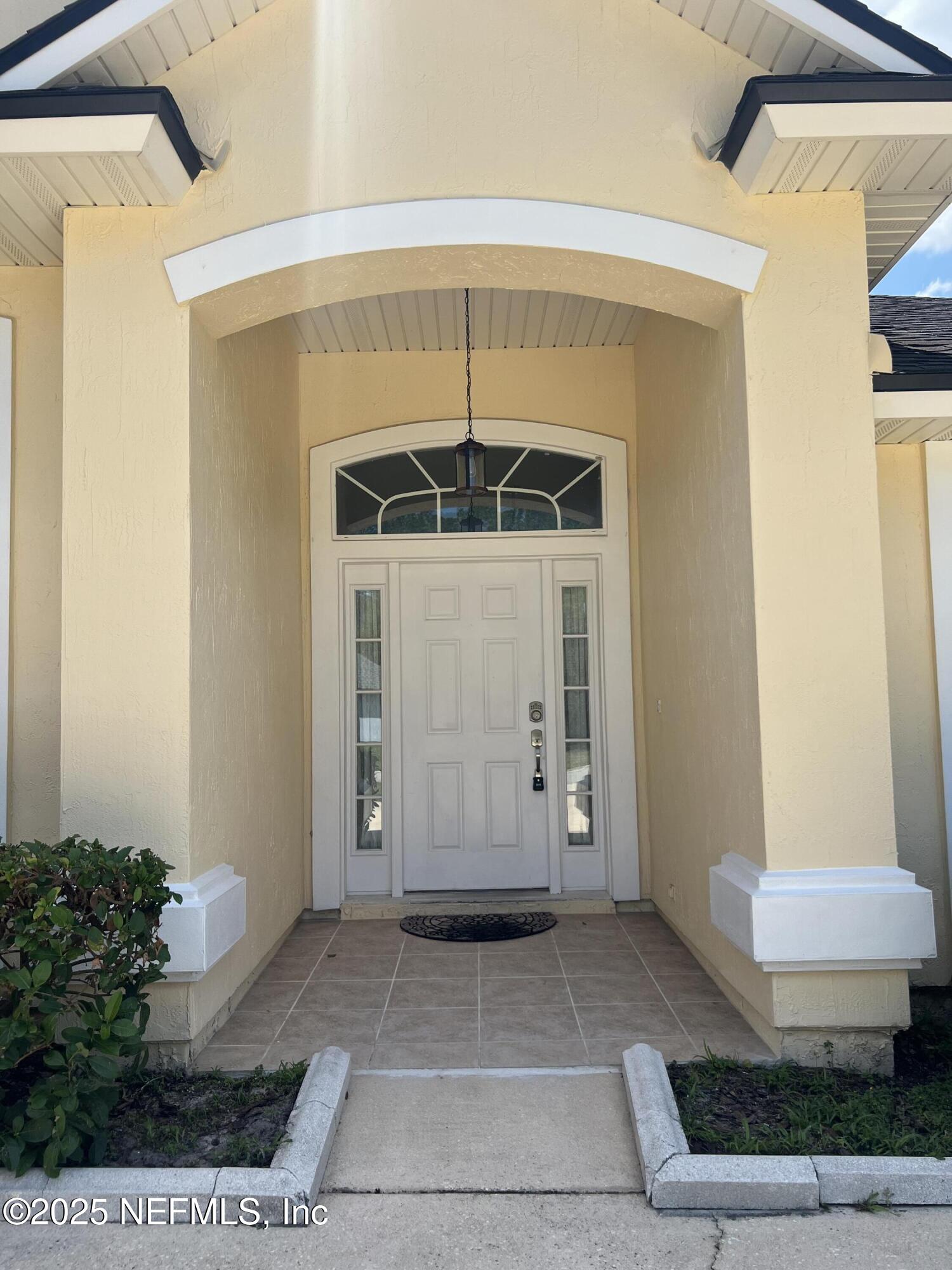 389 Sparrow Branch Circle St. Johns, FL 32259 - Photo 4 of 46 a view of a entryway door of the house