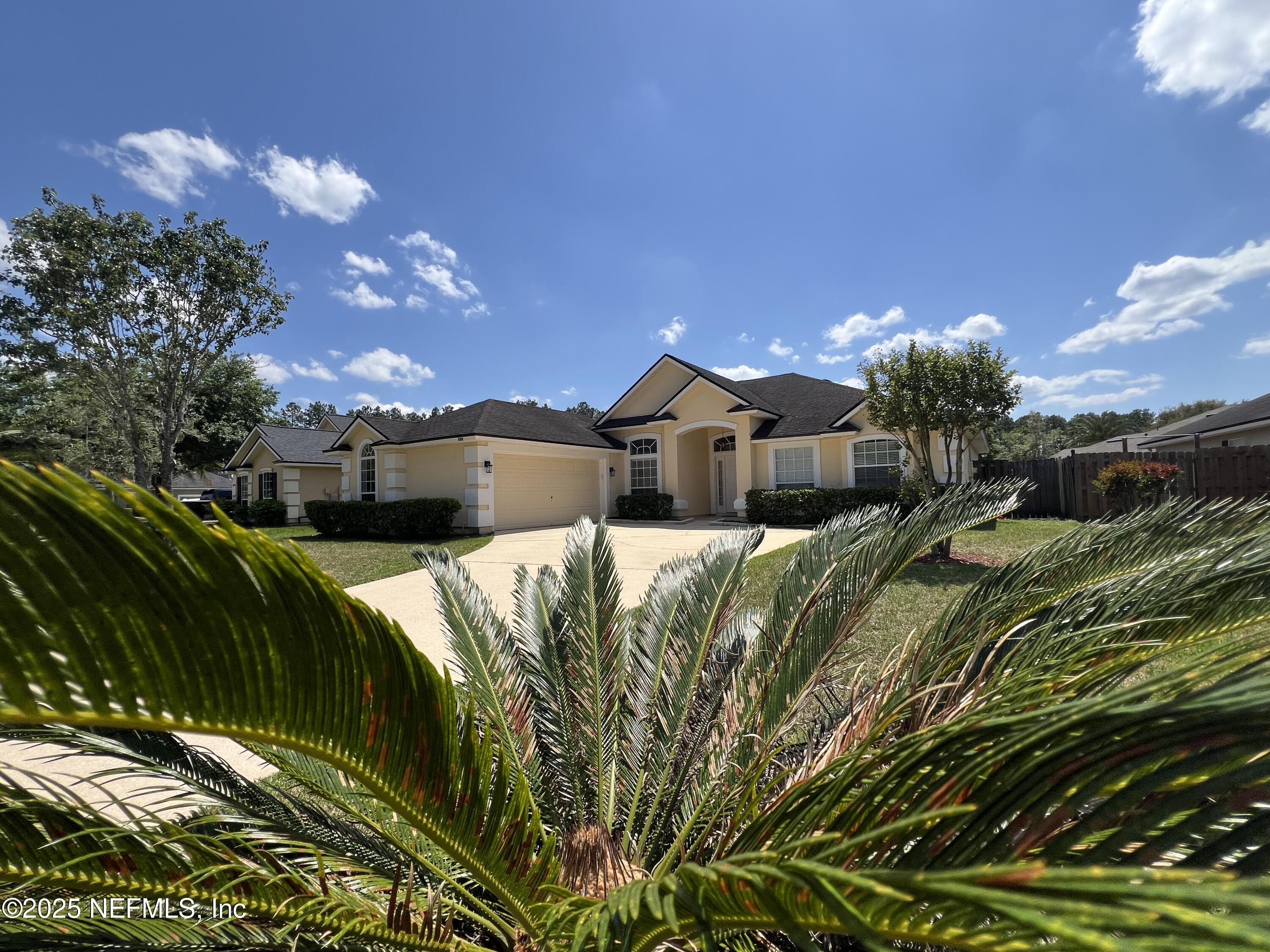 389 Sparrow Branch Circle St. Johns, FL 32259 - Photo 43 of 46 a front view of a house with a yard