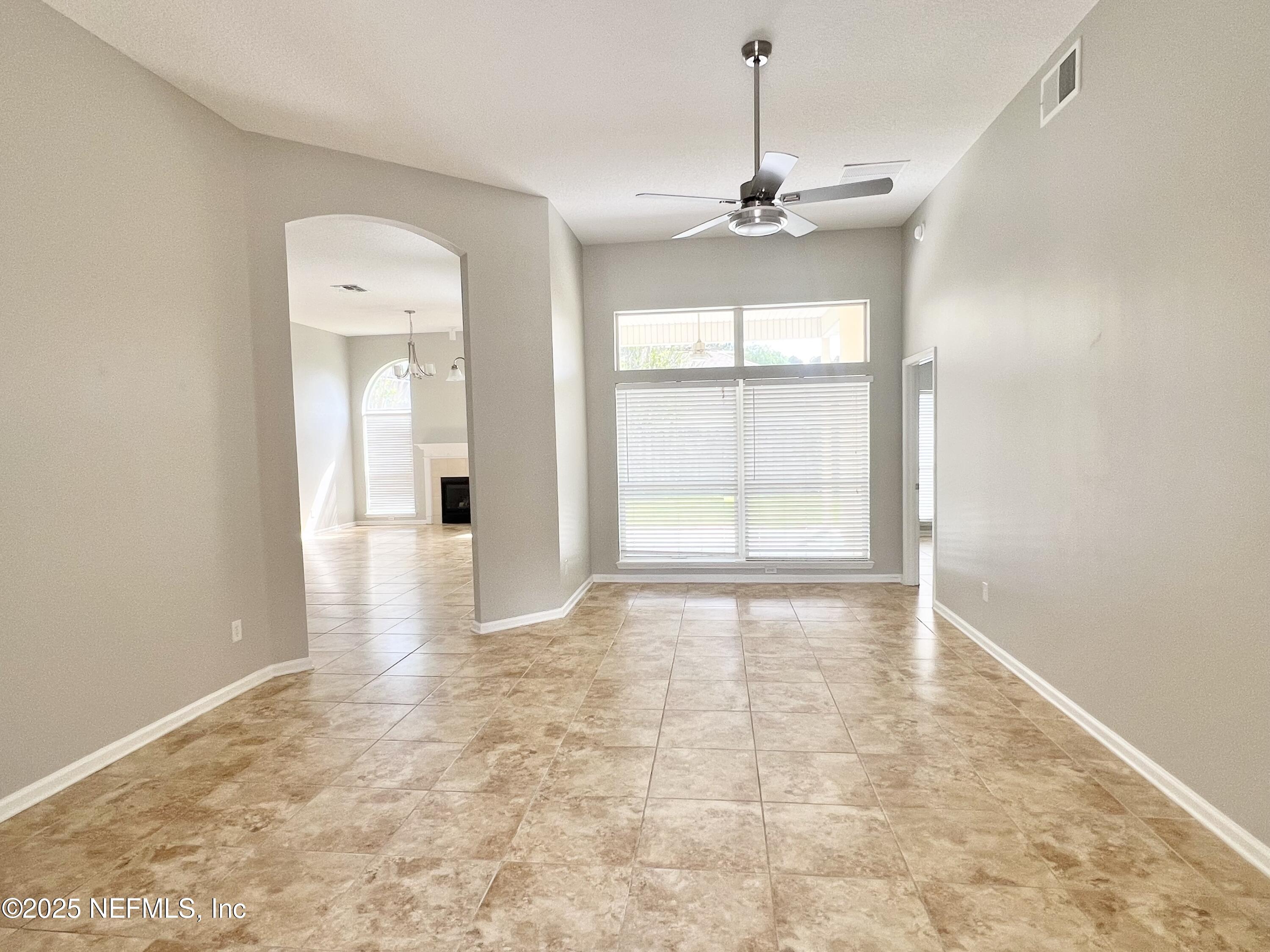 389 Sparrow Branch Circle St. Johns, FL 32259 - Photo 5 of 46 a view of an empty room with a window