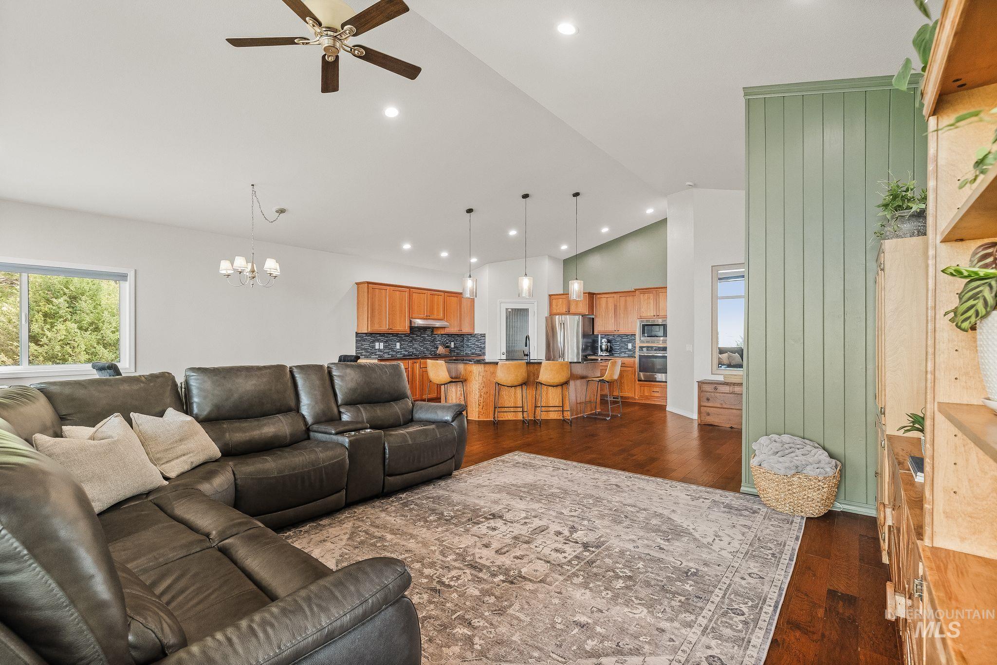 602 Quarry Road Asotin, WA 99402 - Photo 13 of 49 Open-concept living area featuring a vaulted ceiling with recessed lighting and a ceiling fan