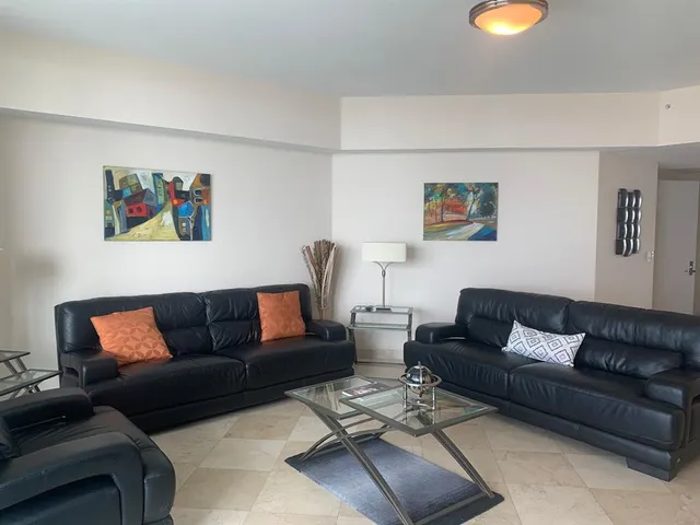 a living room with furniture and a couch