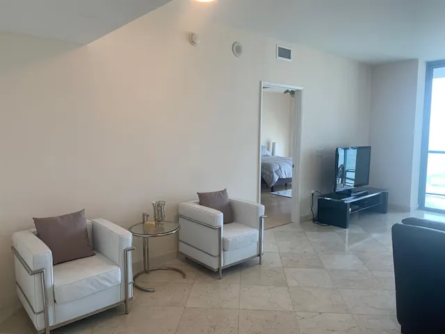 a living room with furniture and a couch