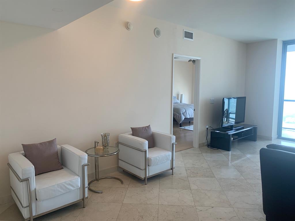 333 Las Olas Way, Unit 2803 Fort Lauderdale, FL 33301 - Photo 15 of 25 a living room with furniture and a couch