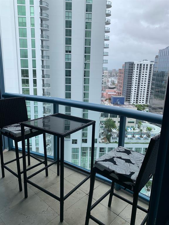 333 Las Olas Way, Unit 2803 Fort Lauderdale, FL 33301 - Photo 23 of 25 a view of a city from a balcony with furniture