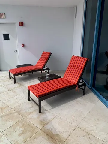a backyard with a table and chairs