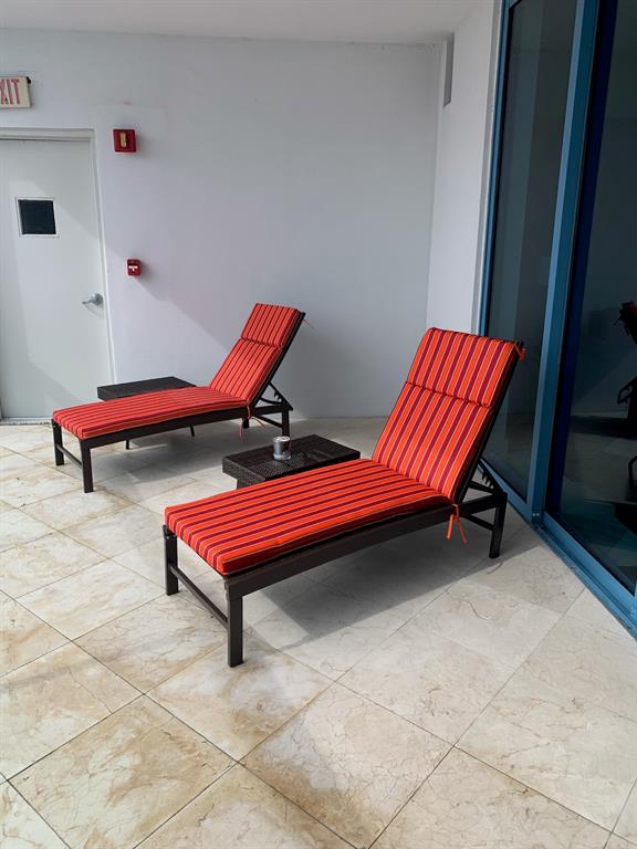 333 Las Olas Way, Unit 2803 Fort Lauderdale, FL 33301 - Photo 25 of 25 a backyard with a table and chairs