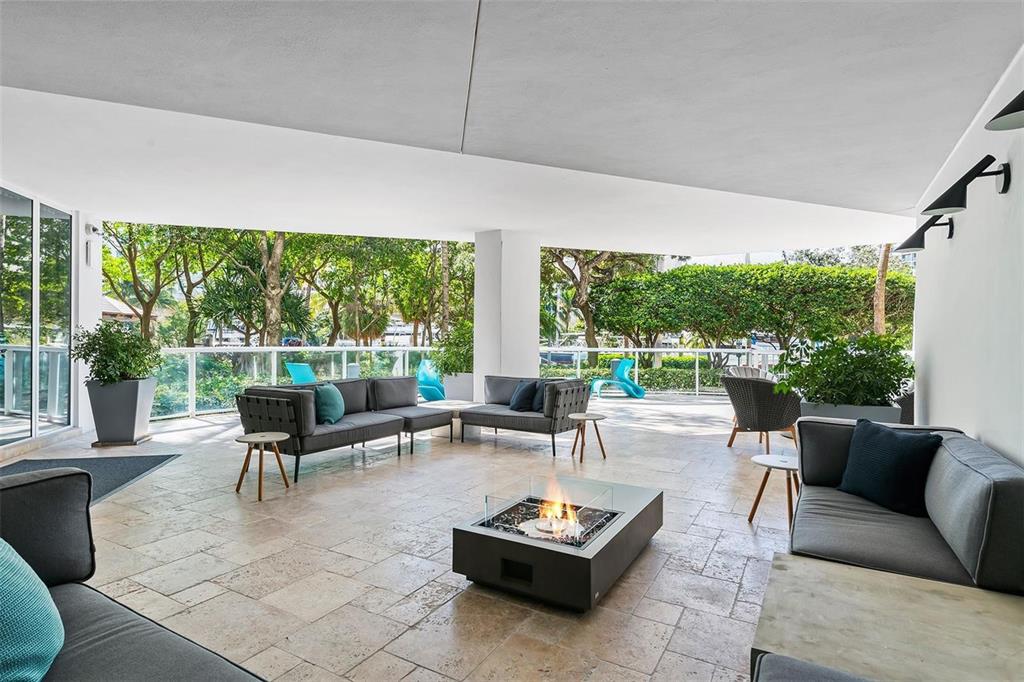 333 Las Olas Way, Unit 2803 Fort Lauderdale, FL 33301 - Photo 6 of 25 a living room with furniture and floor to ceiling windows