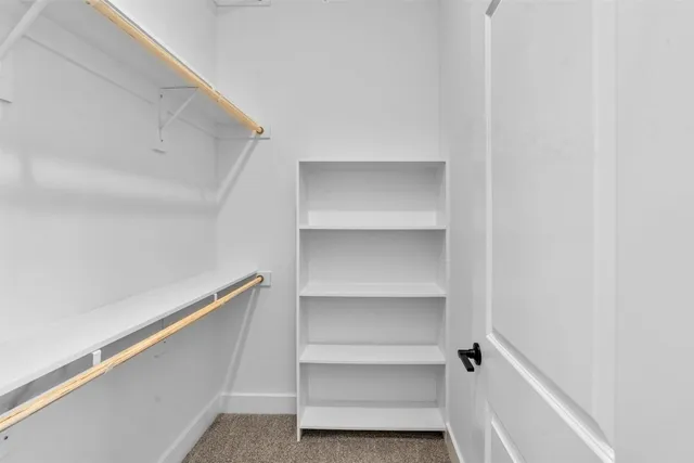a view of an empty walk in closet
