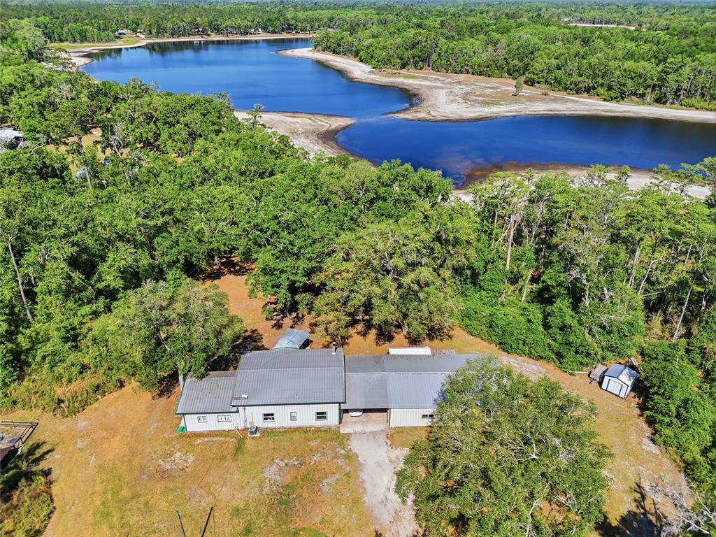 401 Southeast Falcon Road Branford, FL 32008 - Photo 4 of 76 an aerial view of residential house with outdoor space and trees all around