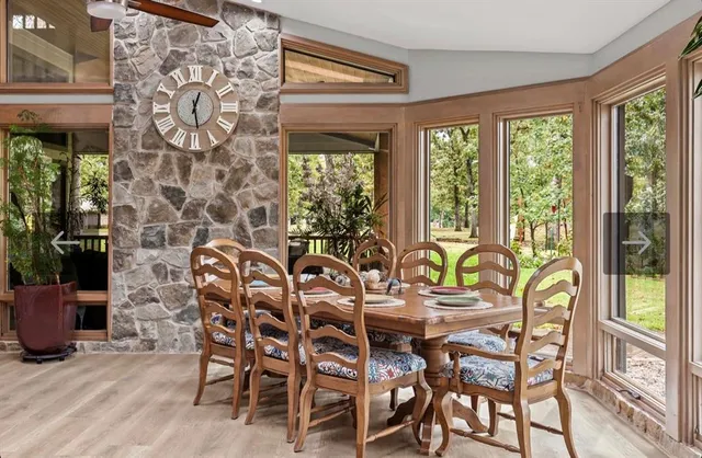 a living room filled with furniture and a potted plant