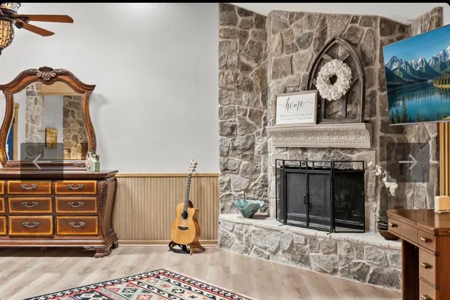a spacious bathroom with a tub double sink and mirror