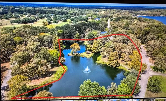 a view of a lake with houses in the back