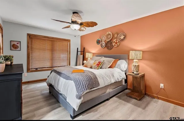 a view of a bathroom with a sink and mirror
