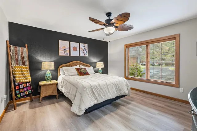 a bedroom with furniture and a window