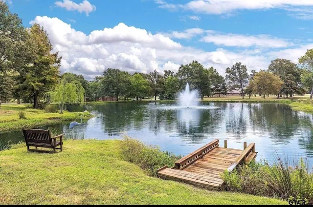 a view of a livingroom with furniture window and wooden floor