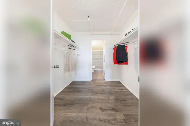 a kitchen with stainless steel appliances granite countertop a stove microwave and refrigerator