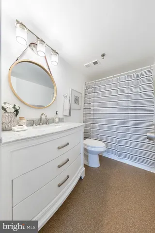 a kitchen with stainless steel appliances granite countertop a sink stove refrigerator and cabinets