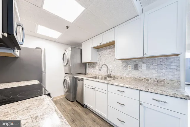a kitchen with a sink and cabinets