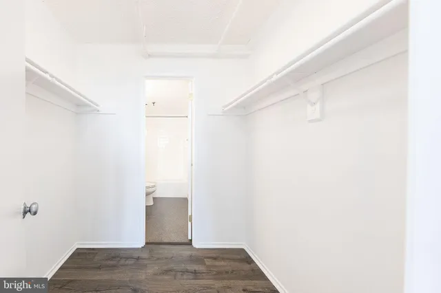 a view of a room with wooden floor