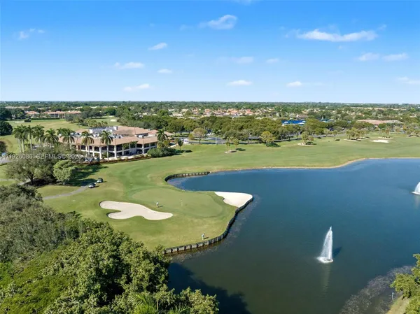 a view of a hallway with entryway window and livingroom view