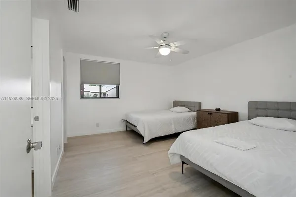 a view of a hallway with a room