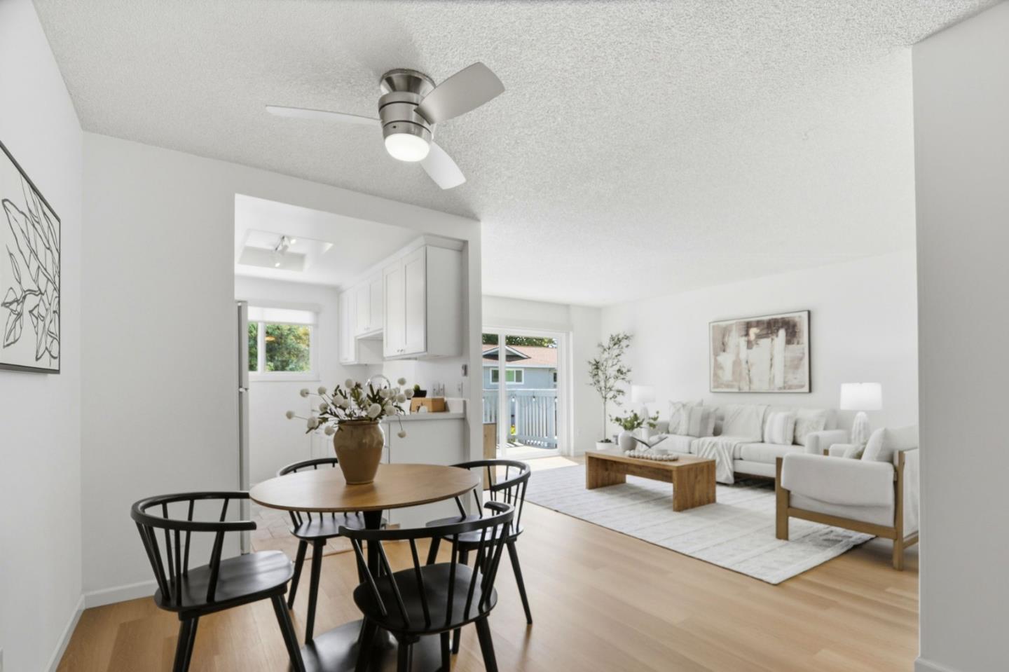 1085 Reed Avenue, Unit D Sunnyvale, CA 94086 - Photo 12 of 32 a view of a dining room with furniture and a chandelier