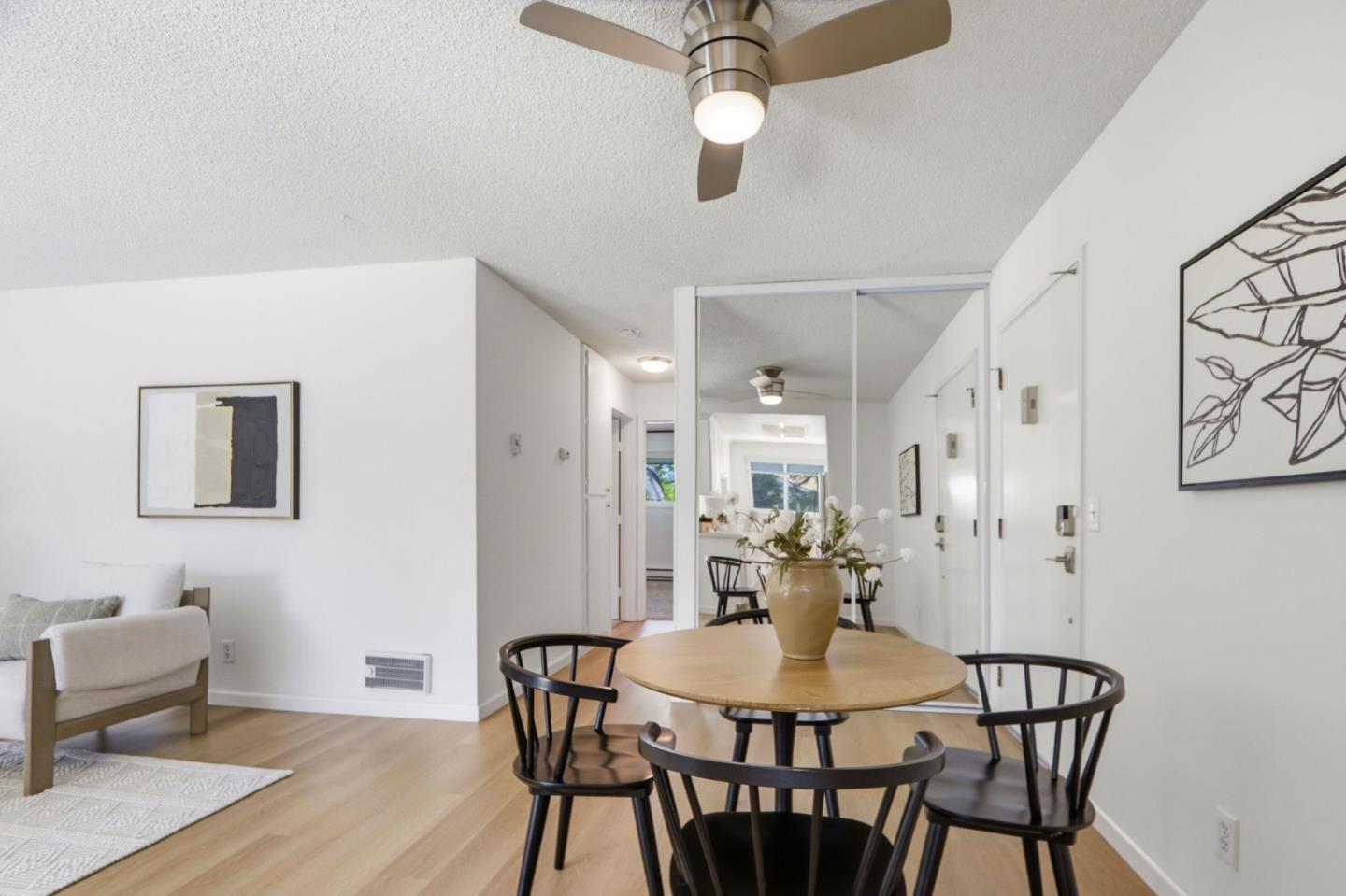 1085 Reed Avenue, Unit D Sunnyvale, CA 94086 - Photo 13 of 32 a view of a dining room with furniture and wooden floor