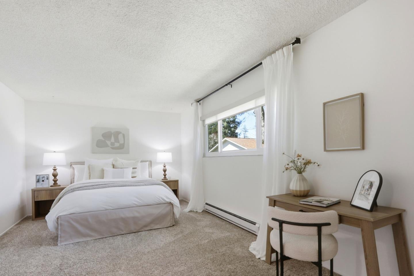 1085 Reed Avenue, Unit D Sunnyvale, CA 94086 - Photo 15 of 32 a bedroom with a bed and a table in it