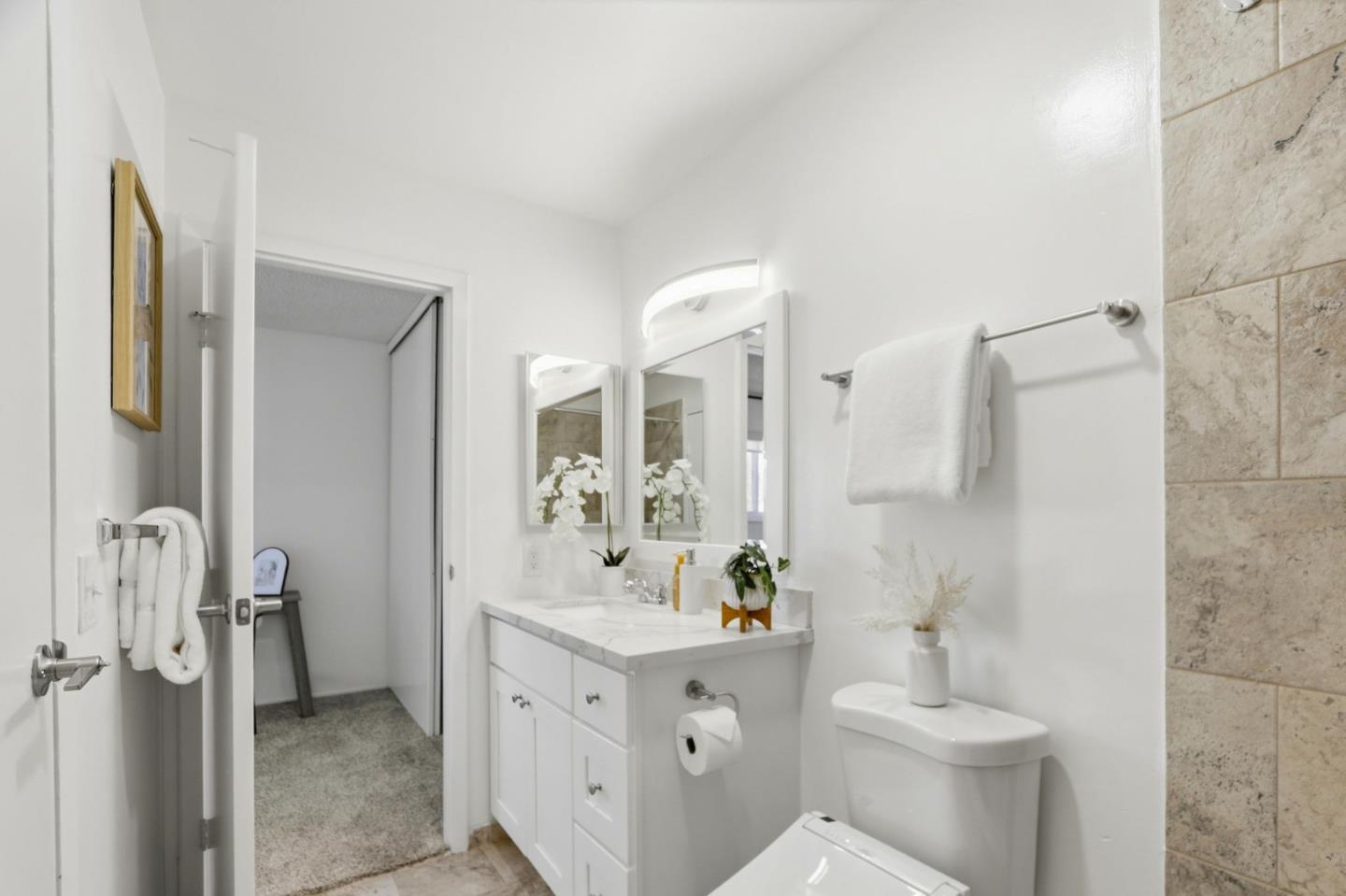 1085 Reed Avenue, Unit D Sunnyvale, CA 94086 - Photo 23 of 32 a bathroom with a sink a toilet and shower