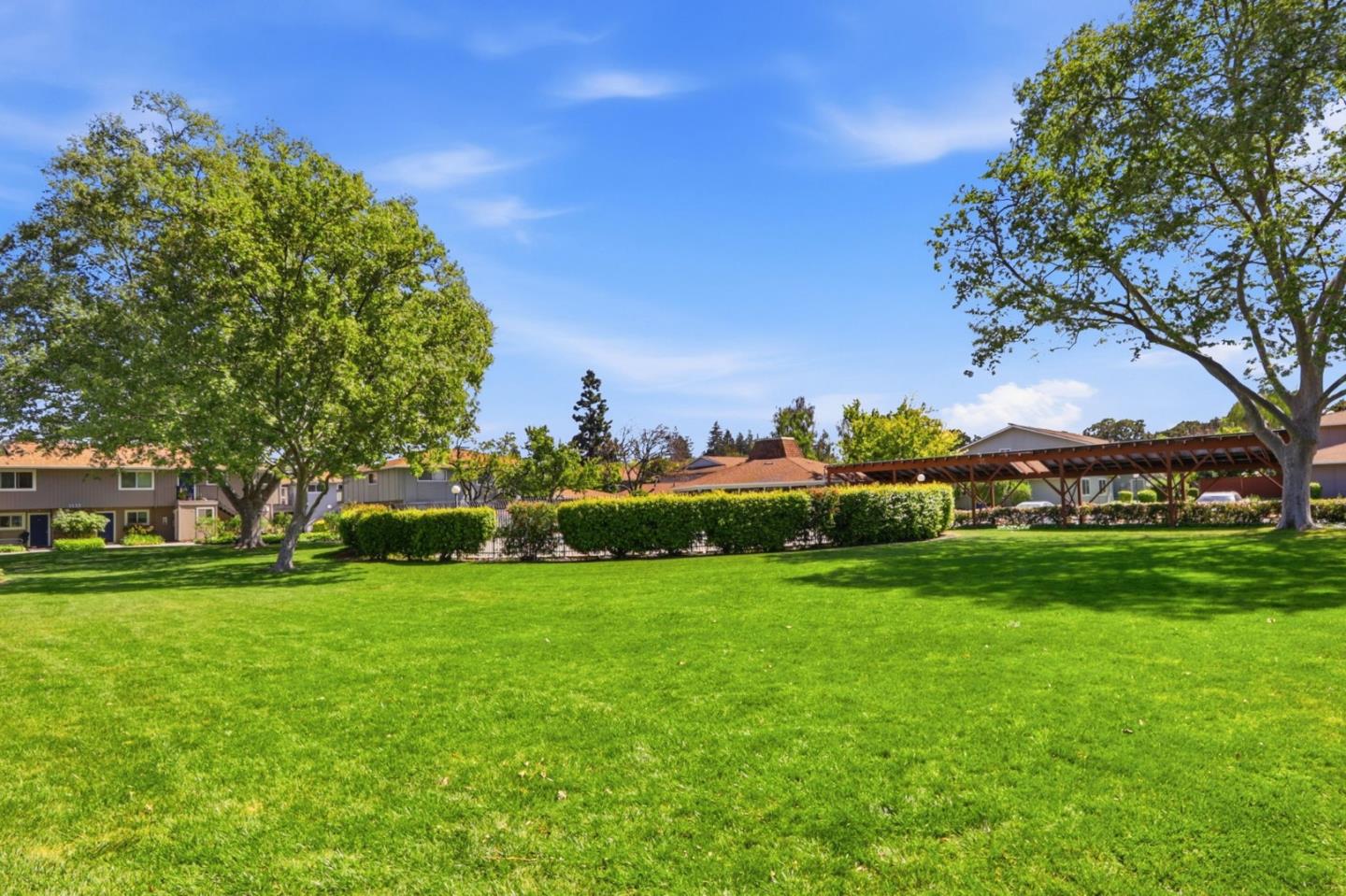 1085 Reed Avenue, Unit D Sunnyvale, CA 94086 - Photo 30 of 32 a view of a field of grass and trees