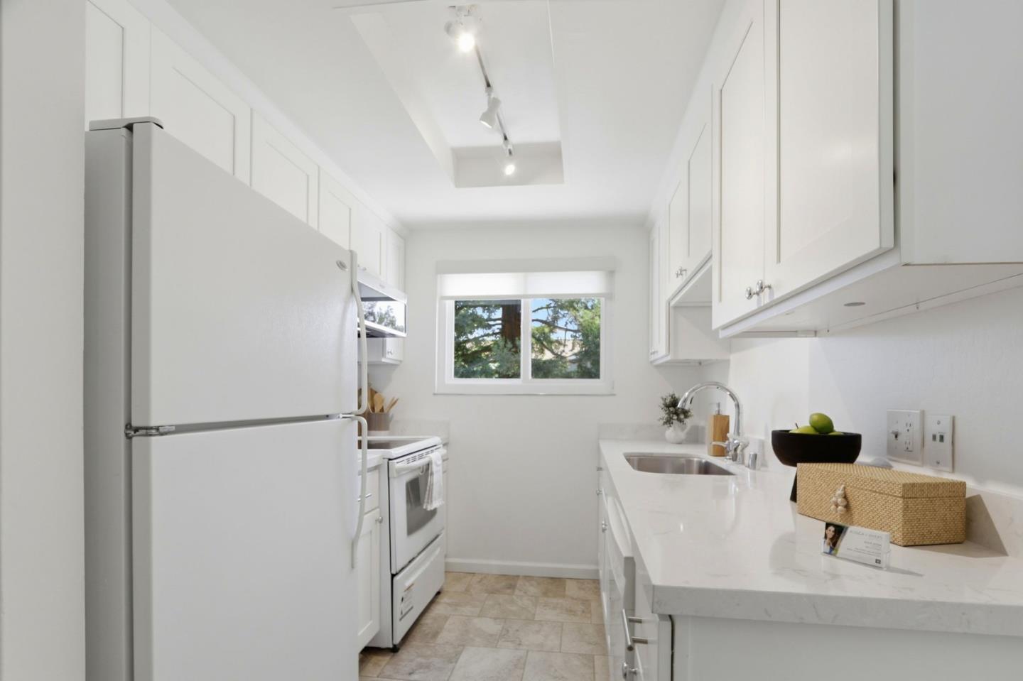 1085 Reed Avenue, Unit D Sunnyvale, CA 94086 - Photo 9 of 32 a kitchen with stainless steel appliances a refrigerator sink and cabinets