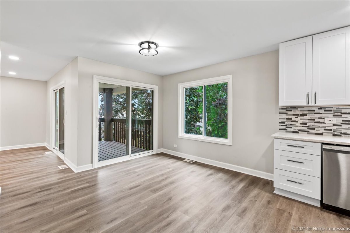 44 Wedgewood Road Matteson, IL 60443 - Photo 9 of 29 a view of an empty room with a window and wooden floor