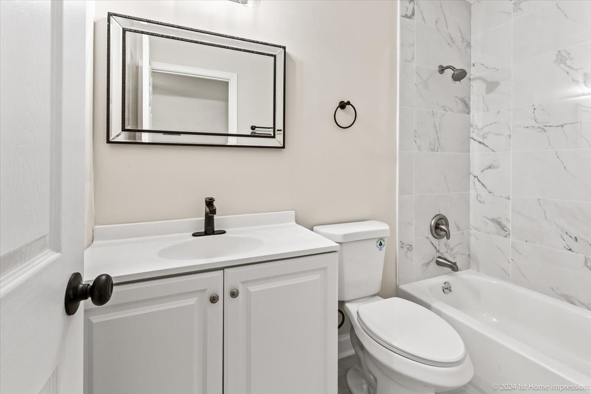 44 Wedgewood Road Matteson, IL 60443 - Photo 10 of 29 a bathroom with a sink toilet and shower