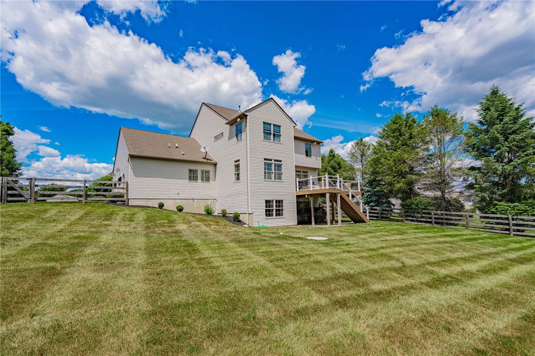 6000 Pond View Terrace Bath, PA 18014 - Photo 58 of 69 A classic facade with a spacious deck offers serene views and comfortable outdoor living.