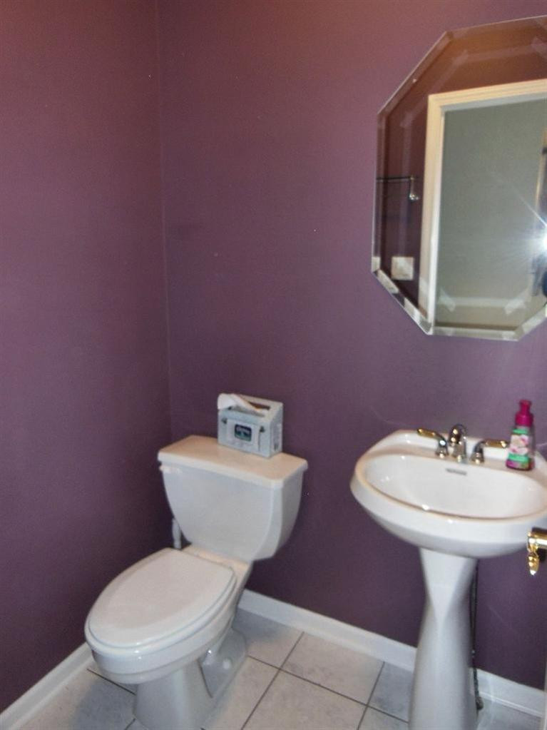 9939 Sequoia Lane Munster, IN 46321 - Photo 14 of 41 a bathroom with a toilet sink and mirror