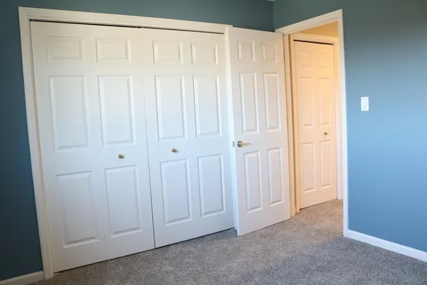 an empty room with a wooden door