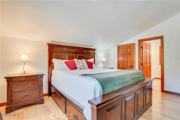 a bedroom with a bed and a dresser