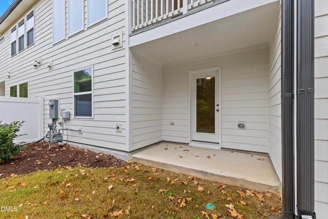 an empty room with window and mirror