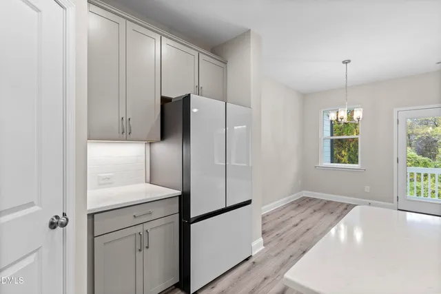 a kitchen with kitchen island a sink stainless steel appliances and cabinets