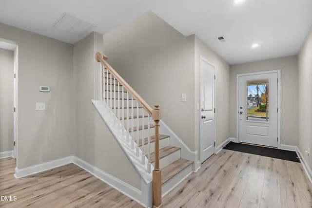 a view of a white building with many windows