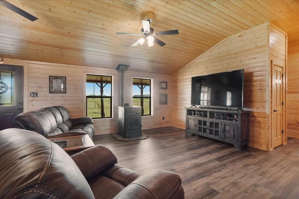 2290 Brooks Lane Sadler, TX 76264 - Photo 11 of 36 a living room with furniture and a flat screen tv