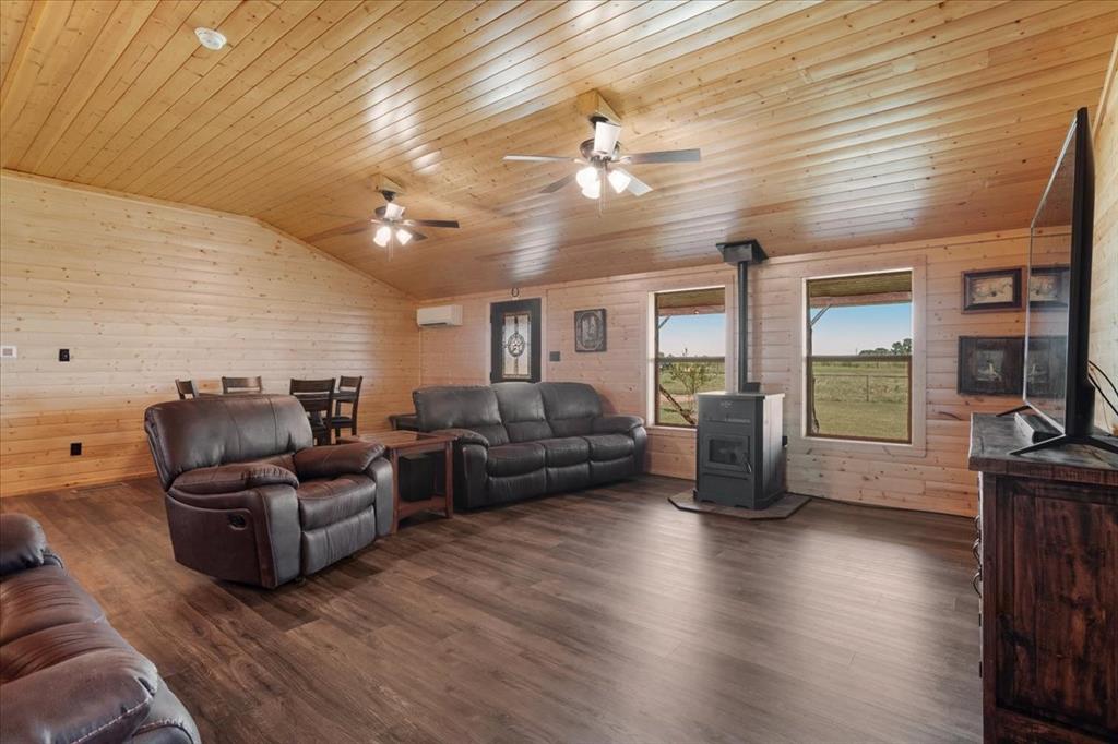 2290 Brooks Lane Sadler, TX 76264 - Photo 12 of 36 a living room with furniture and a flat screen tv