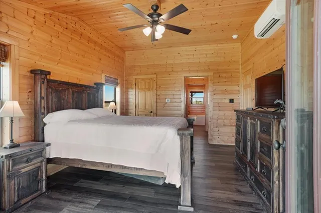 a bed room with a bed and a television