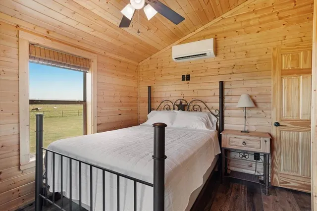 a bedroom with a bed and a table