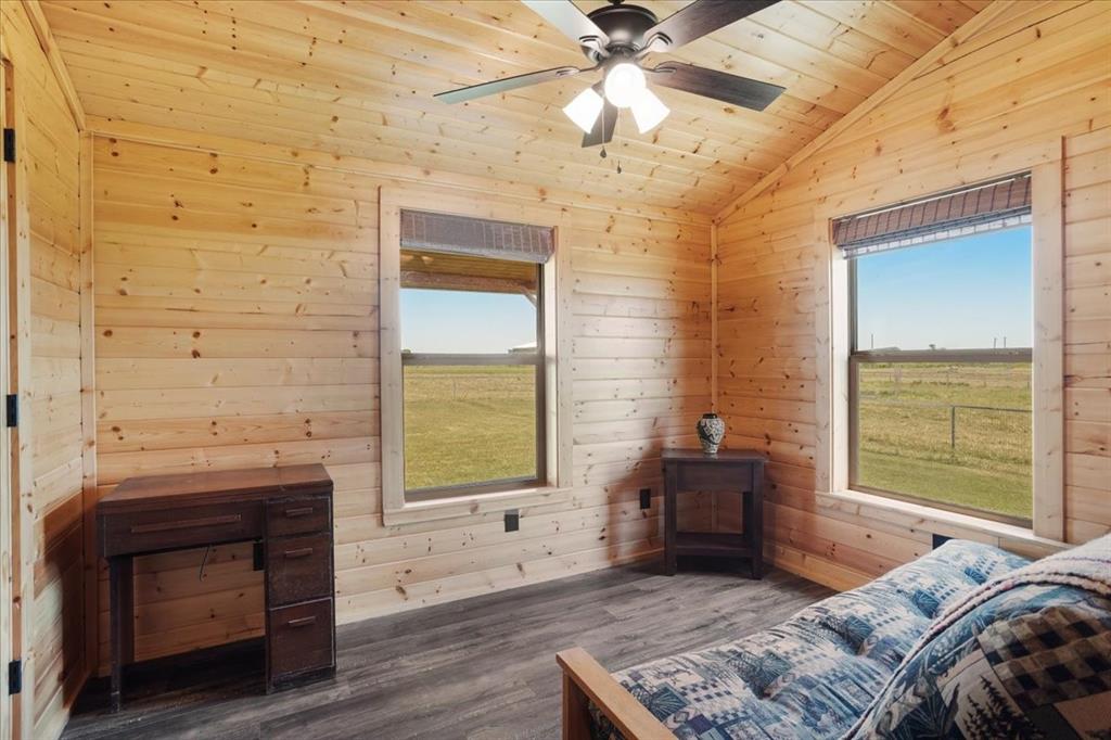 2290 Brooks Lane Sadler, TX 76264 - Photo 22 of 36 a bedroom with a bed and a chandelier