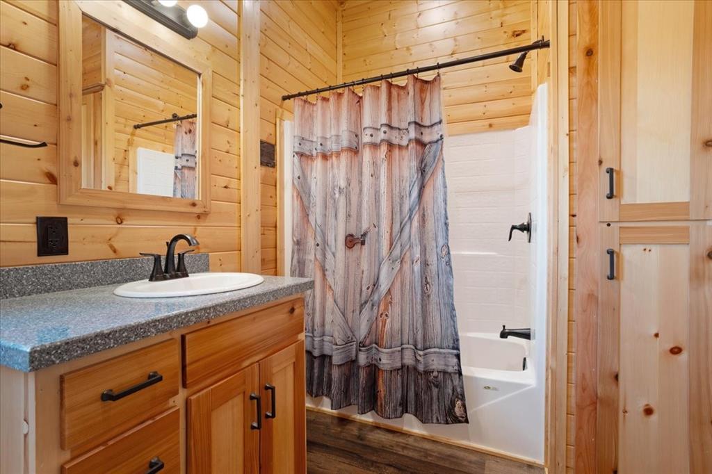 2290 Brooks Lane Sadler, TX 76264 - Photo 25 of 36 a view of a bathroom with a sink and a mirror