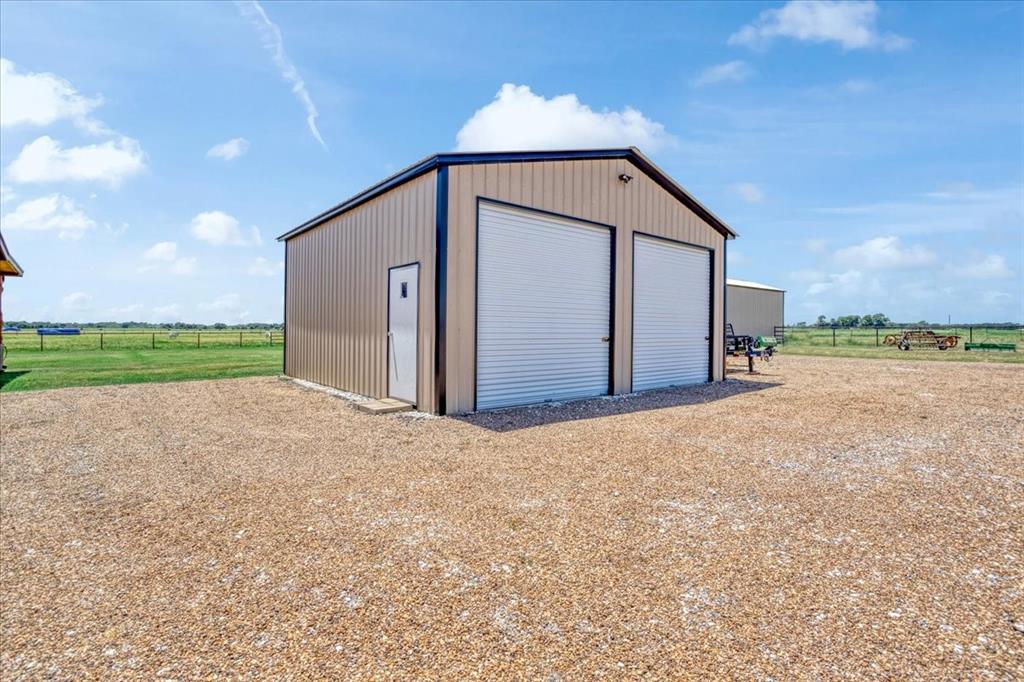 2290 Brooks Lane Sadler, TX 76264 - Photo 26 of 36 a view of a house with a yard and garage