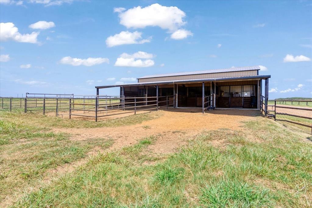 2290 Brooks Lane Sadler, TX 76264 - Photo 30 of 36 a view of a house with a backyard and a patio